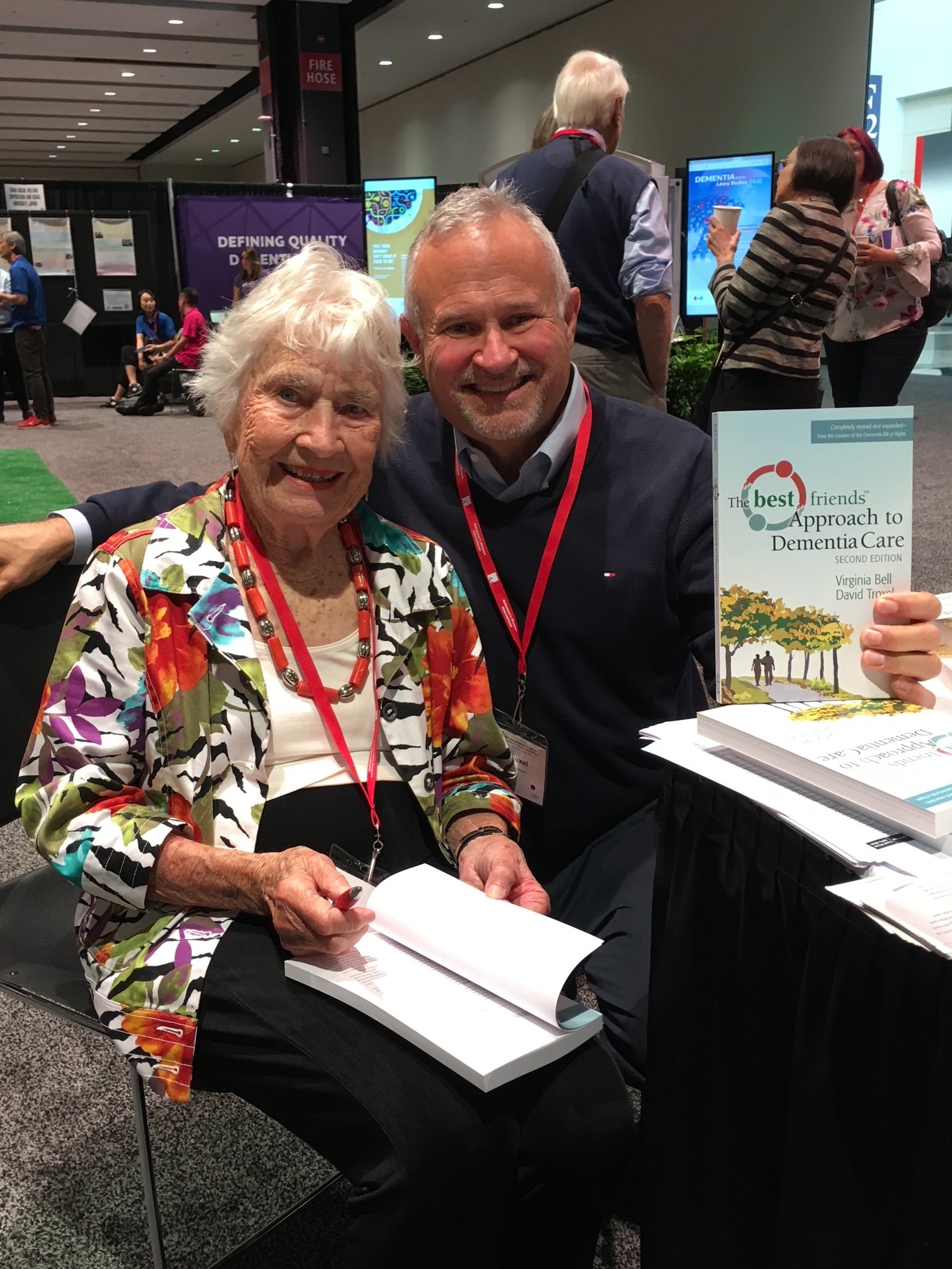 Virginia Bell and David Troxel signing their book